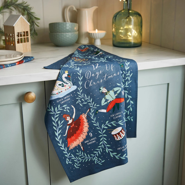 Ulster Weavers 12 Days of Christmas Cotton Tea Towel on the kitchen counter