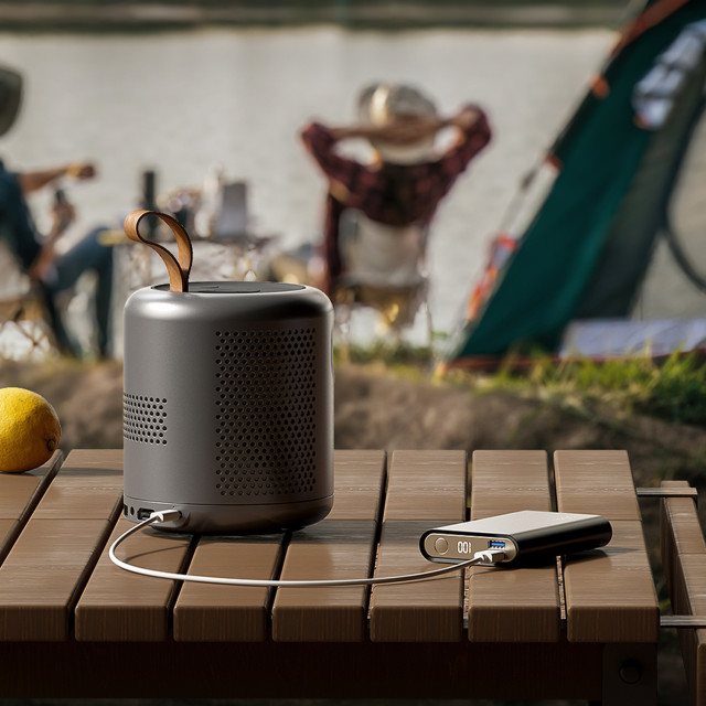 Etoe Dolphin Google Portable TV Projector on the table charging