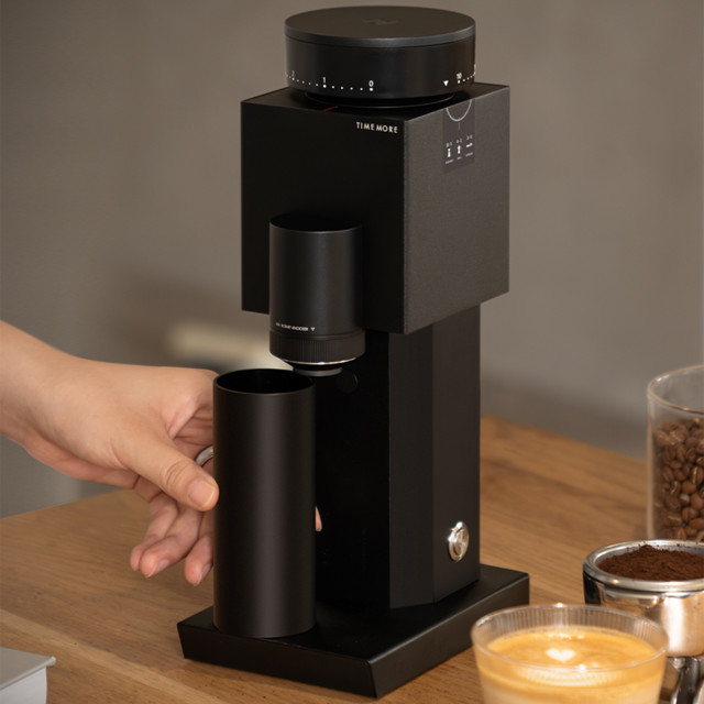 Timemore Bricks 01s Electric Coffee Grinder with a cup of coffee