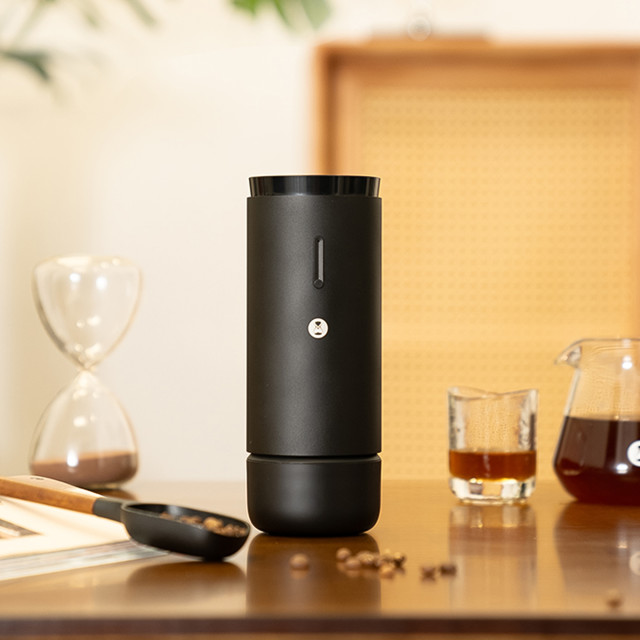 Timemore Whirly 01s Rechargeable Coffee Grinder with a cup of coffee