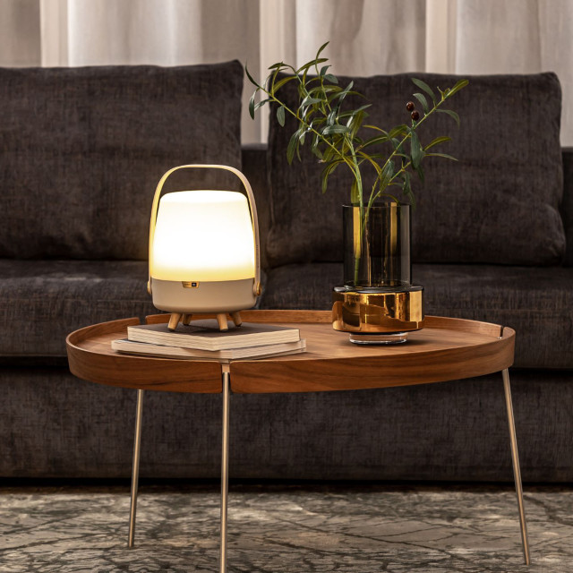 Kooduu Lite-Up Play Mini JBL Speaker & Lamp - White/Sand on a coffee table