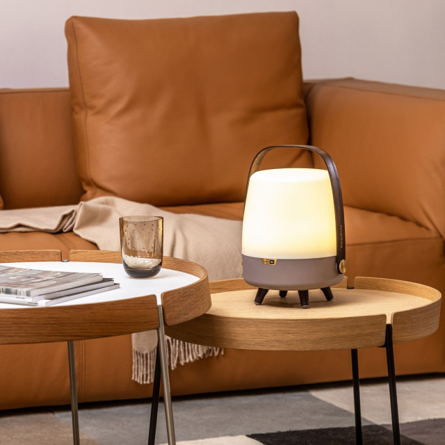 Kooduu Lite-Up Play Mini JBL Speaker & Lamp - White/Earth on a coffee table