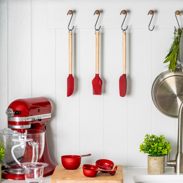 KitchenAid Birchwood Basting Brush hung with other utensils on the kitchen hanger