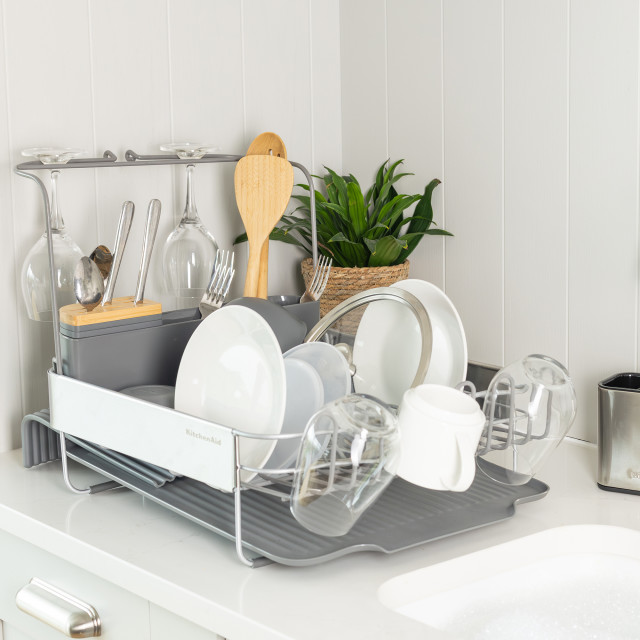 KitchenAid Expandable Dish Drying Rack with dishes and glasses