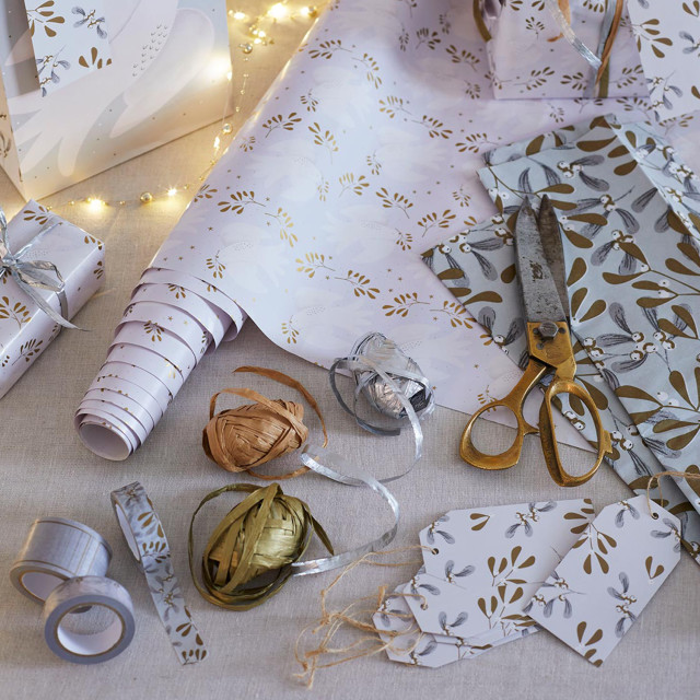 Talking Tables Botanical Mistletoe Wrapping Paper Roll, 3m on the table