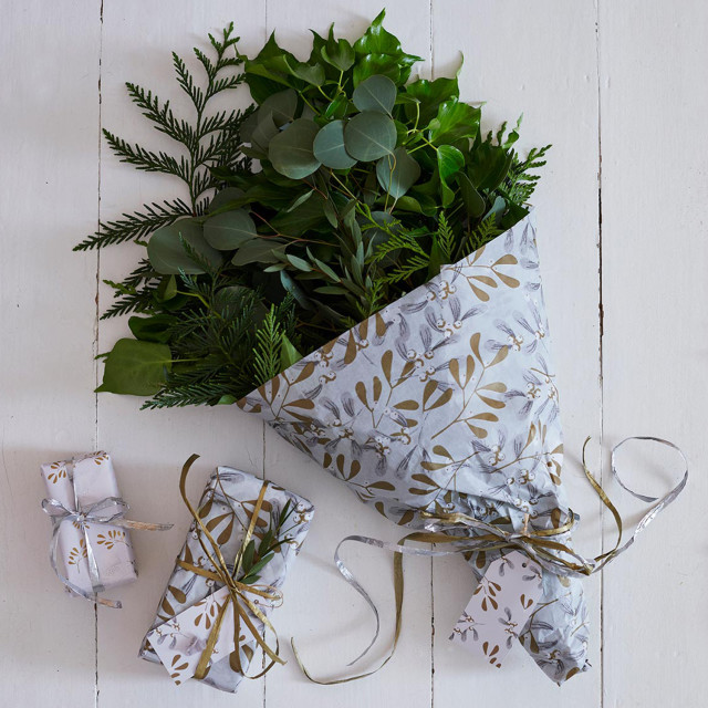 Talking Tables Botanical Mistletoe Wrapping Paper Roll, 3m on the table