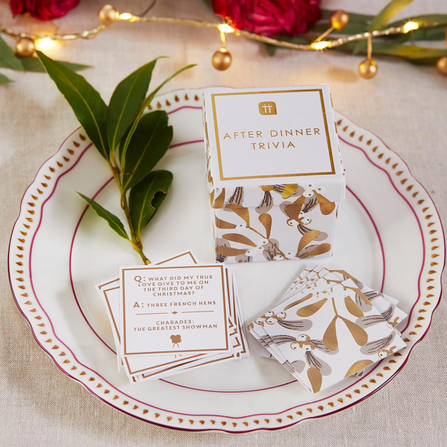 Talking Tables Botanical Mistletoe Christmas Trivia And Charades Game on a dinner plate