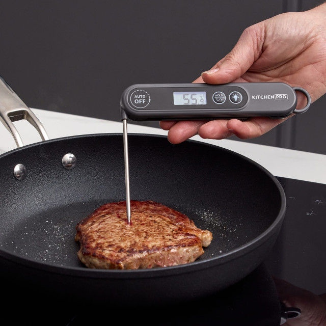 Kitchen Pro Precision Foldable Digital Thermometer with meat on a pan
