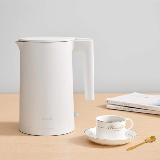 Xiaomi Electric Kettle 2, 1.7L on the table with a tea cup and saucer