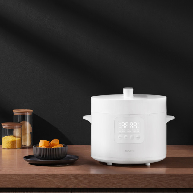 Xiaomi Smart Electric Pressure Cooker, 4.8L on the table with food