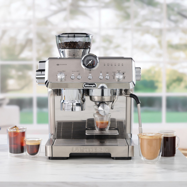 DeLonghi La Specialista Opera Manual Pump Espresso Coffee Machine, EC9555.M with cups of coffee