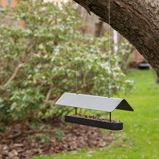 Eva Solo Hanging Bird Feeder Bar hung on a tree