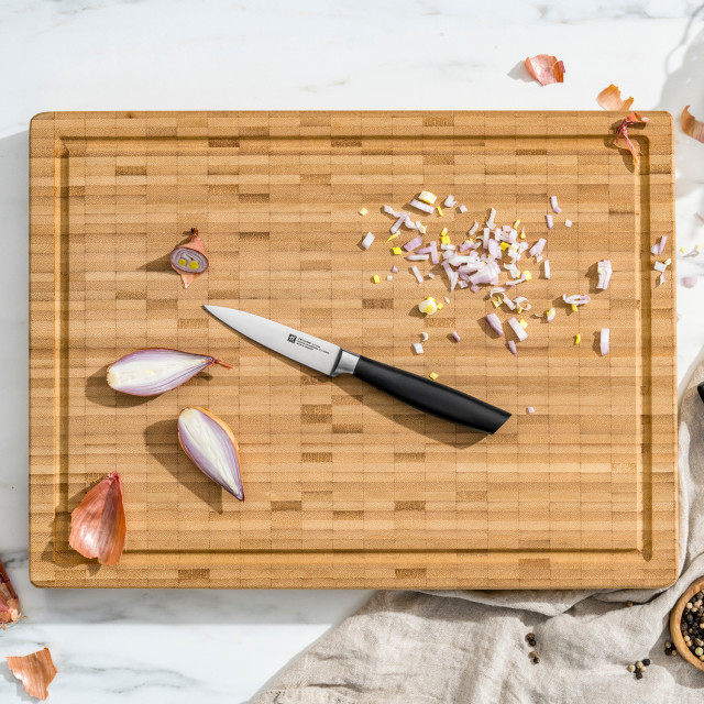 Zwilling All Star Self-Sharpening Knife Block Set, 7-Piece paring knife on a chopping board