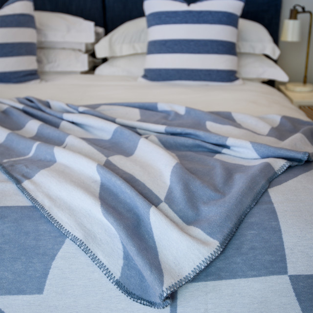 Aranda Overcast Sky White Amanda Throw, 200cm x 230cm on a bed