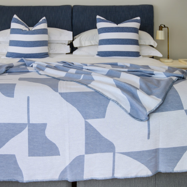 Aranda Overcast Sky White Amanda Throw, 200cm x 230cm on a bed