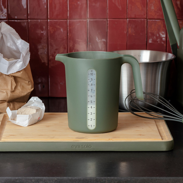 Eva Solo Green Tools Measuring Jug, 1L on a chopping board
