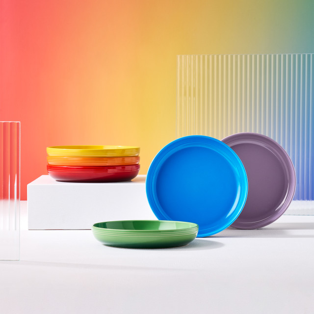 Le Creuset Rainbow Collection Coupe Pasta Bowls, Set of 6 on a plinth and stacked