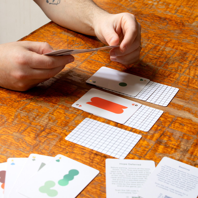 Suck UK Mello Solo Playing Cards on the table