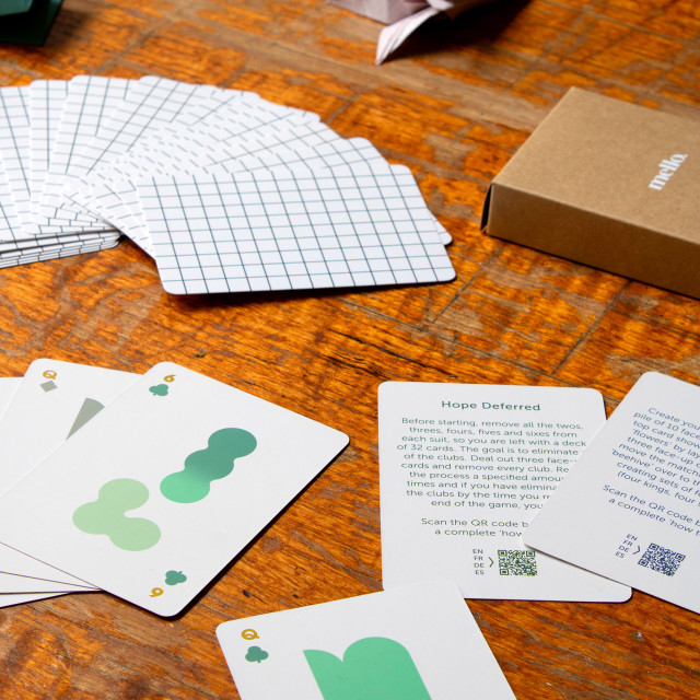 Suck UK Mello Solo Playing Cards on the table