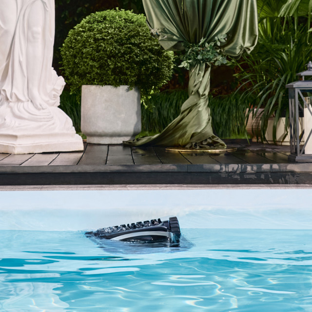 Aiper Scuba X1 Pro Max Robotic Pool Cleaner on thw surface of the pool