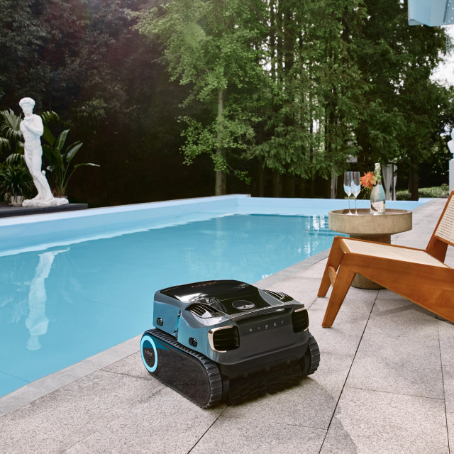 Aiper Scuba X1 Pro Max Robotic Pool Cleaner next to pool