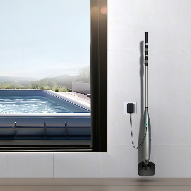 Aiper Pilot X1 Handheld Pool Vacuum placed in storage against a wall