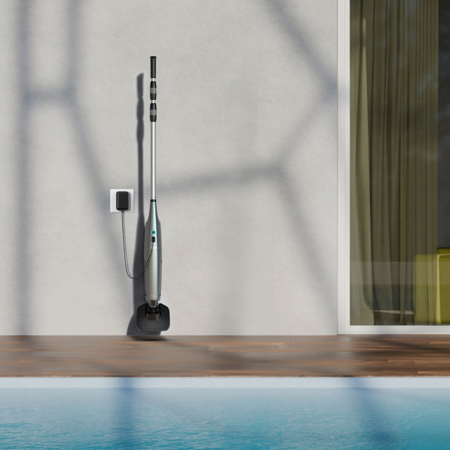 Aiper Pilot X1 Handheld Pool Vacuum placed in storage against a wall