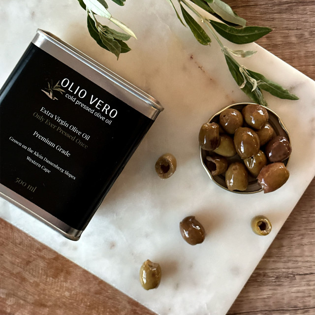 Olio Vero Extra Virgin Olive Oil - 500ml on board with olives