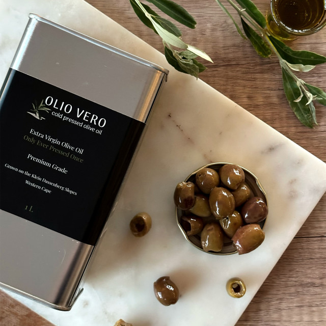 Olio Vero Extra Virgin Olive Oil - 1L on board with olives