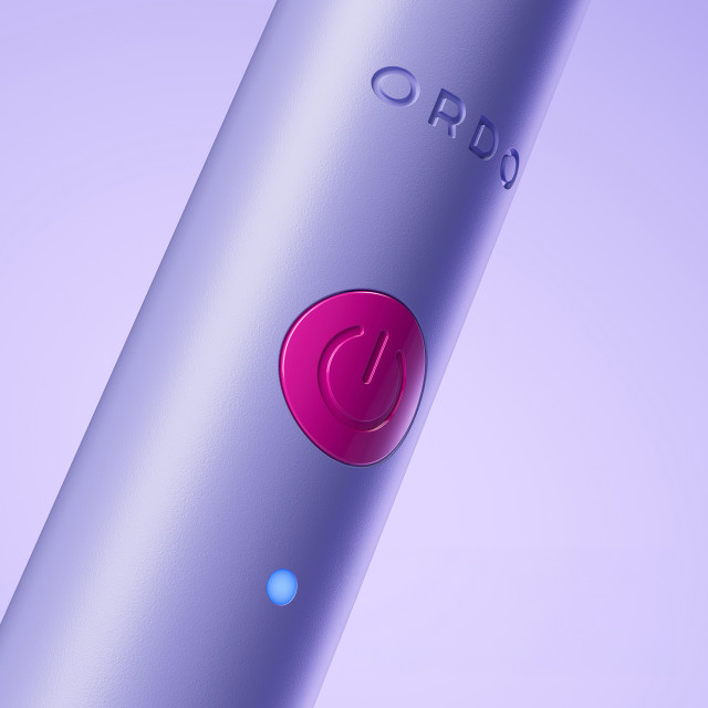 Ordo Sonic Edge Rechargeable Toothbrush - Fiji Fuchsia on/off button close up