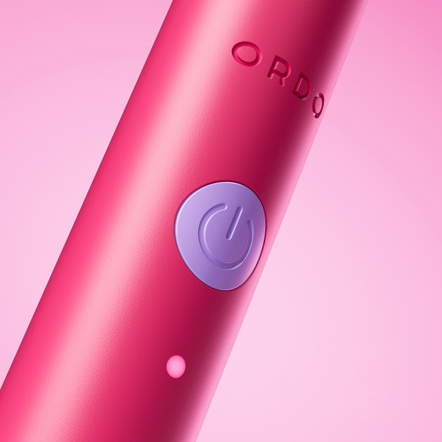 Ordo Sonic Edge Rechargeable Toothbrush - Paradise Pink on/off button close up