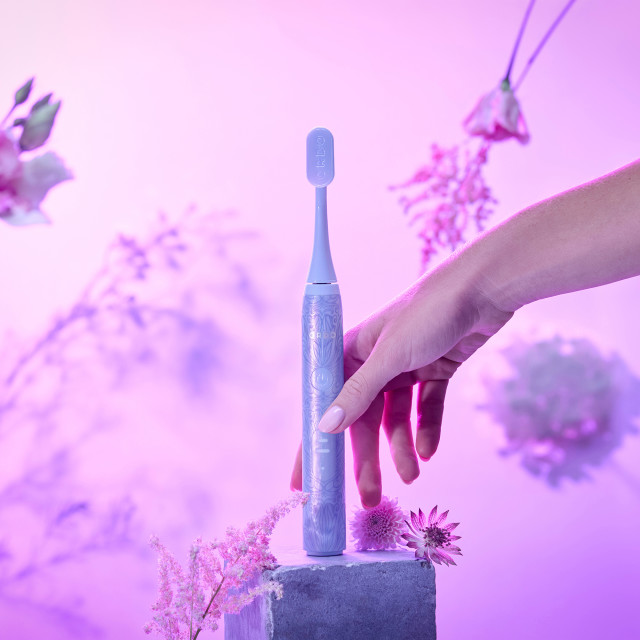Ordo Sonic Lite Wicked Edition Electric Toothbrush - Wicked Glinda Purple on a stone