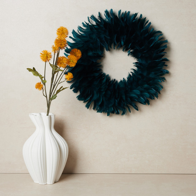 Humble & Mash Green Feather Wreath on wall
