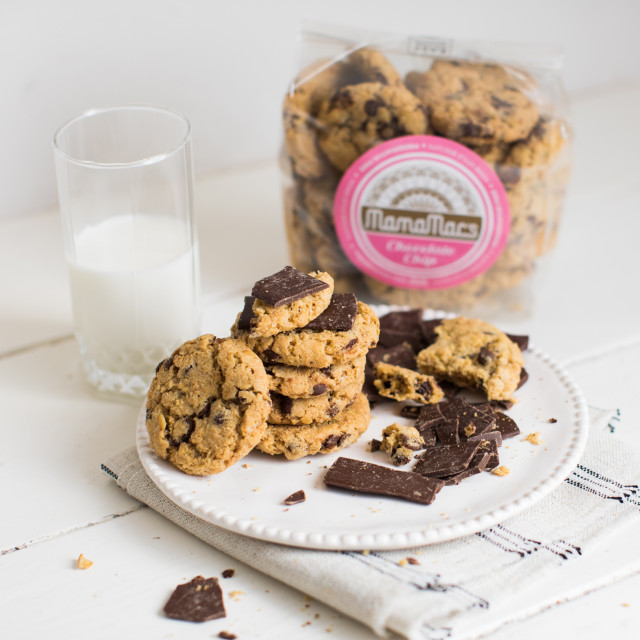 Mamamac's Choc Chip Biscuits next to a glass of milk