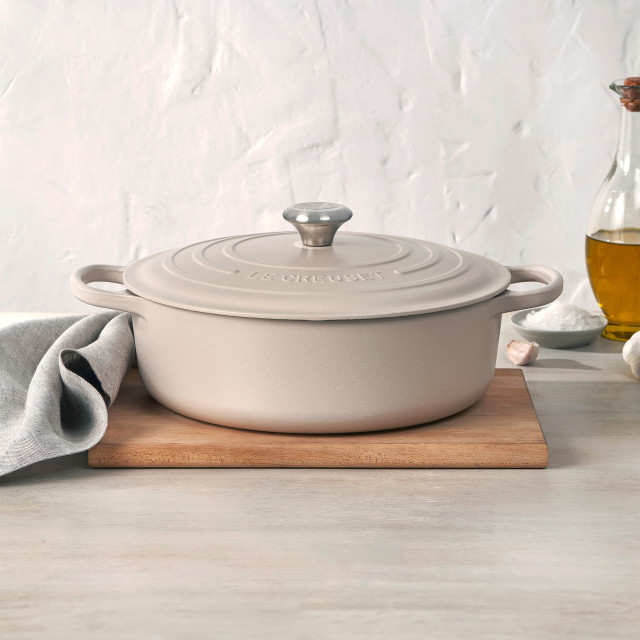 Le Creuset Brioche Signature 6.3 Litre Oval Cast Iron Casserole, 31cm on the table