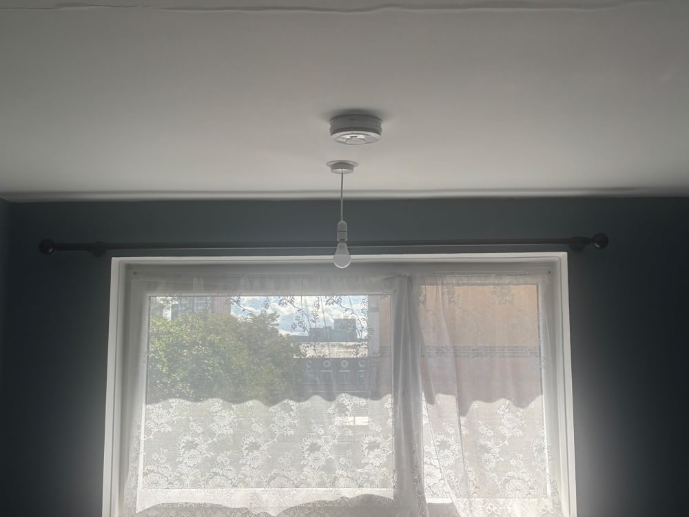 Curtain pole fitted neatly above a window