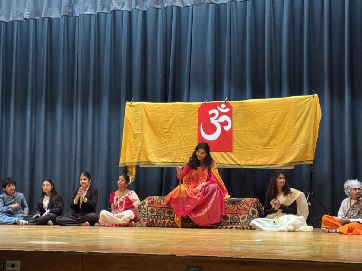 Children performing a cultural program on stage