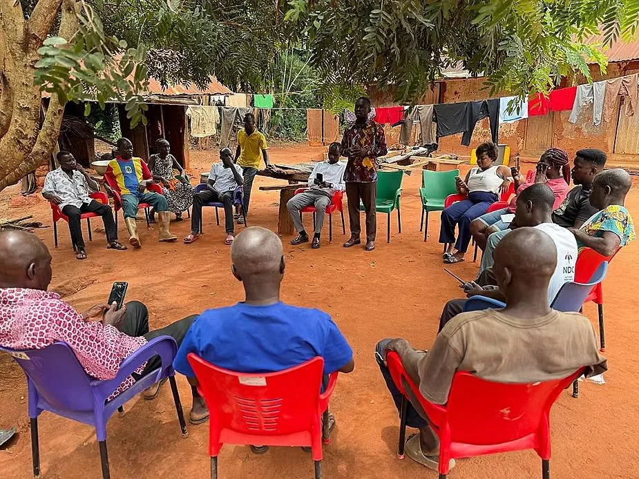 Hon. Dominic Gyasi interacting with residents during a community engagement tour
