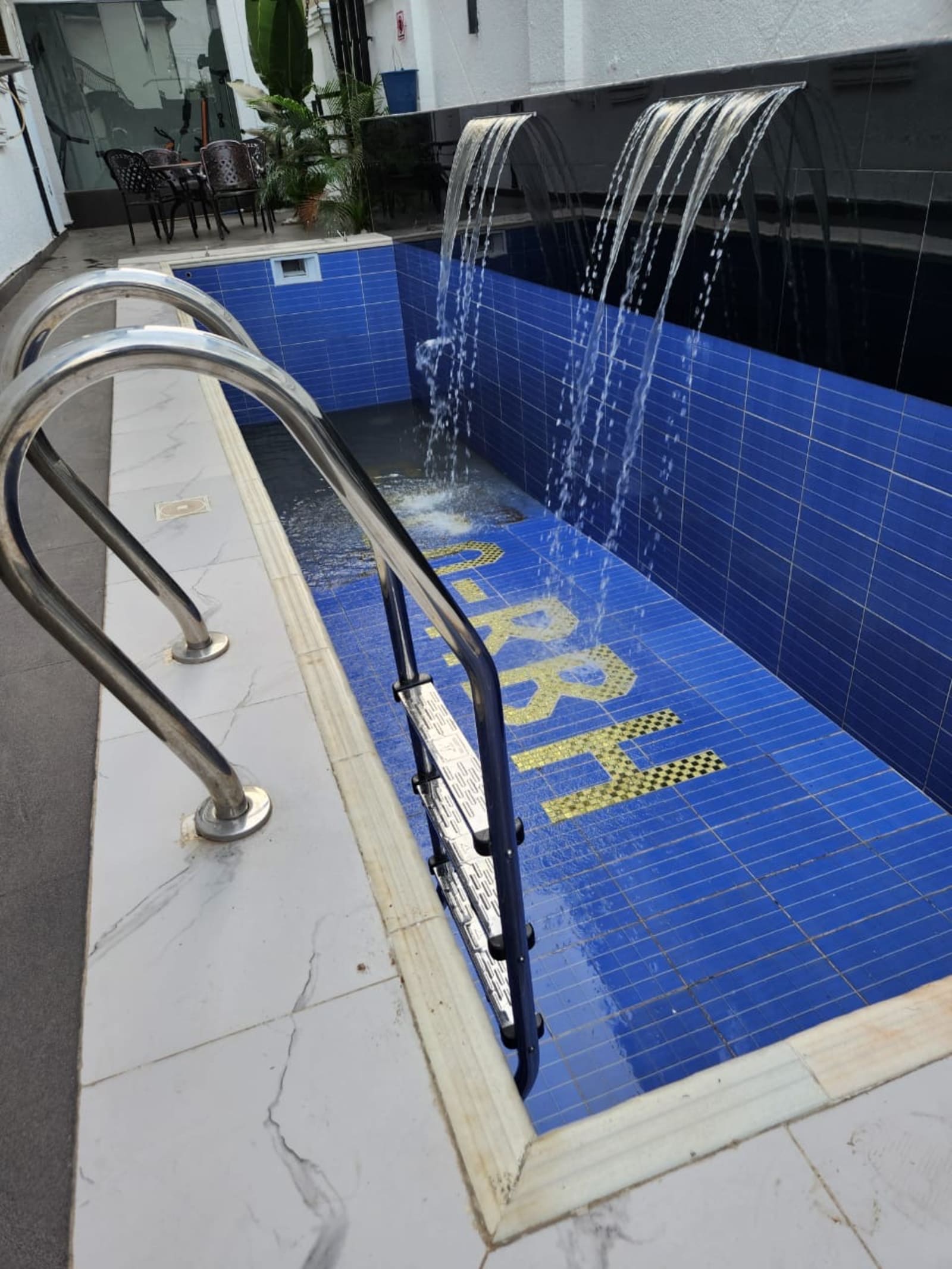 Waterfall Wall Lap Luxury Pool — Water Fountains pool project built by Metrixpool in Nigeria