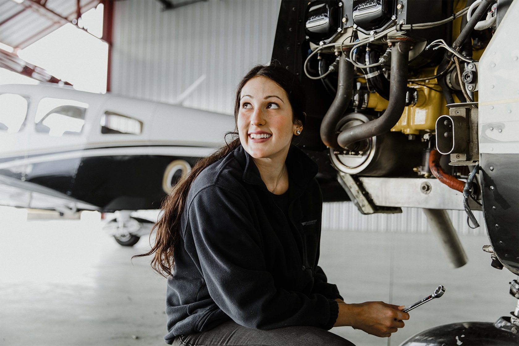 woman fixing airplane
