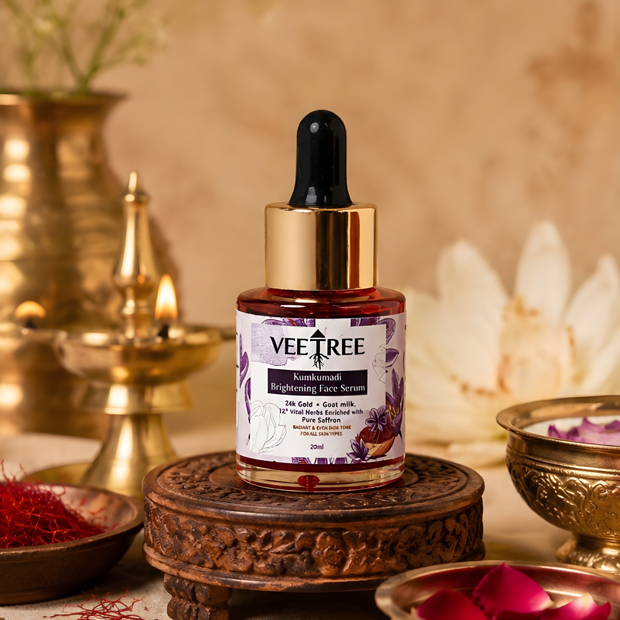 Veetree Kumkumadi Serum in a glass dropper bottle beside a brass lamp and saffron threads