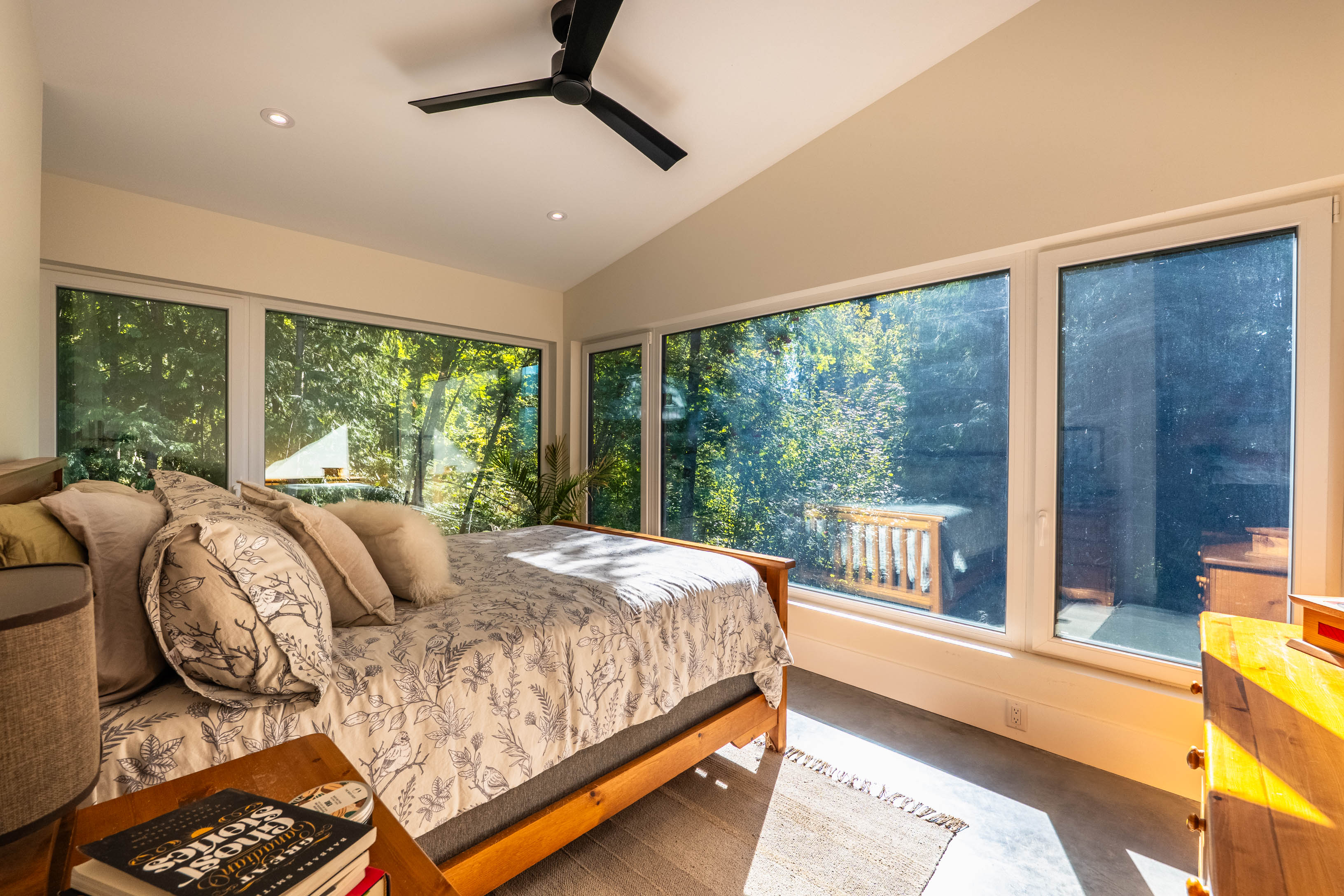 Bedroom with tree framed windows at 1409 Ash Street