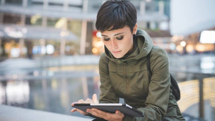Woman checking about pregnancy pills on her tablet