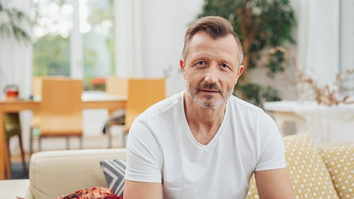 Zava cholesterol levels patient Jeff sitting on a sofa
