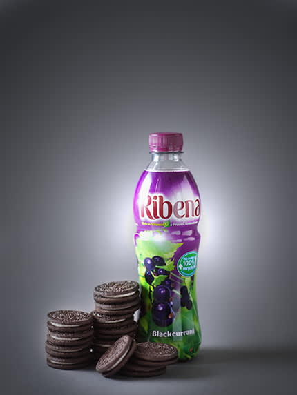 bottle of ribena next to oreo cookies