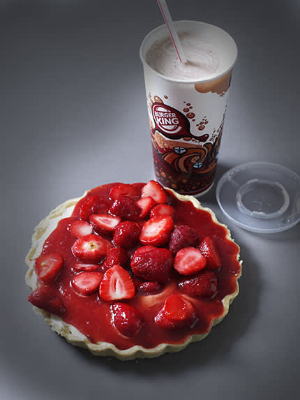 burger king hot chocolate next to a strawberry tart