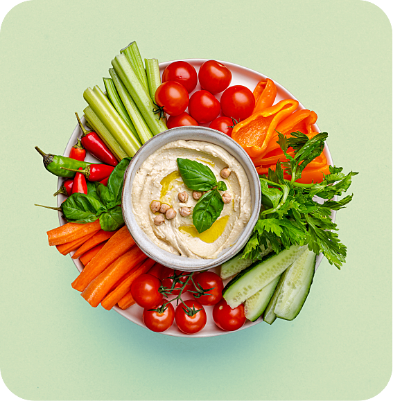 sliced vegetables and hummous dip