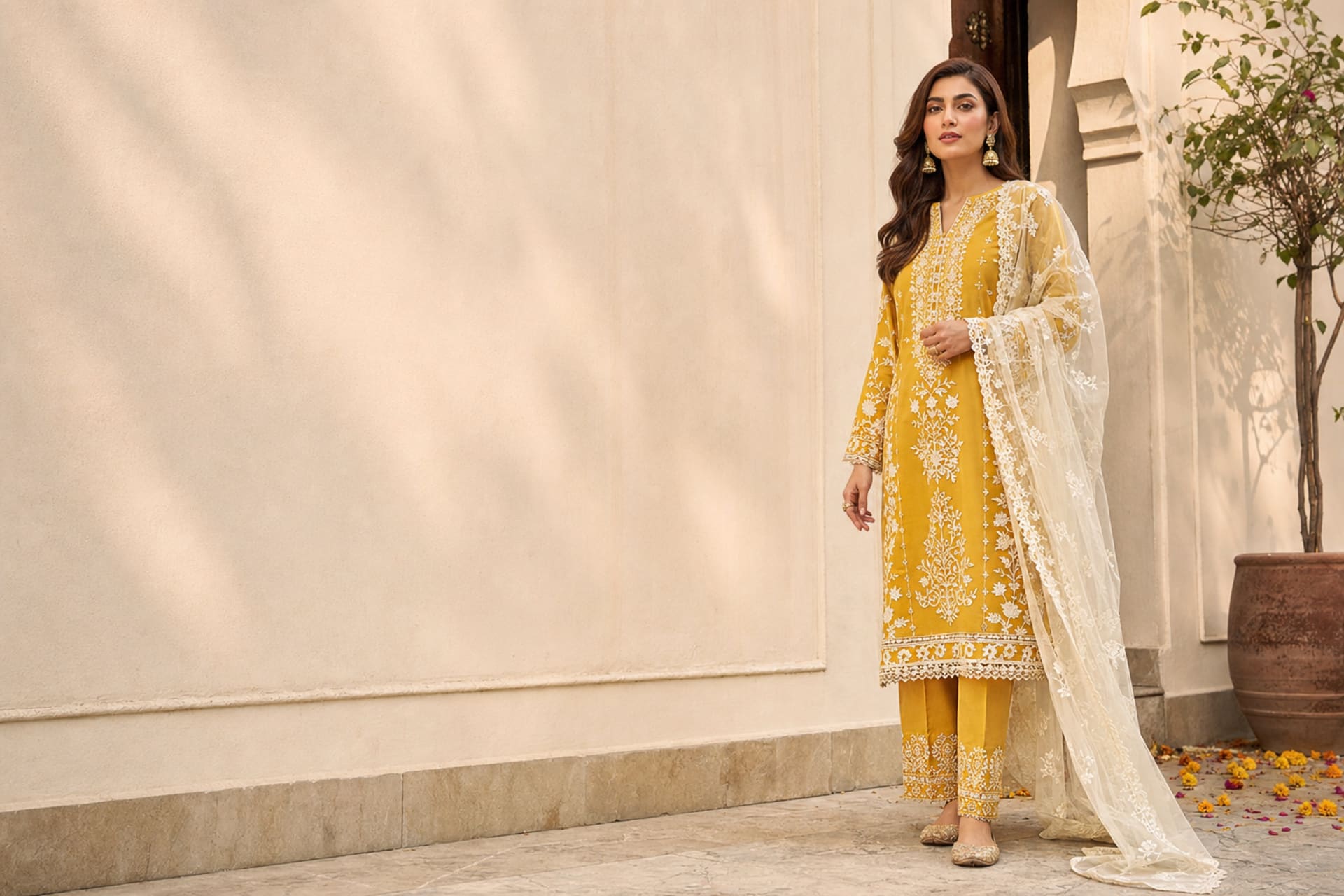 Yasara in a mustard embroidered lawn suit with an ivory dupatta