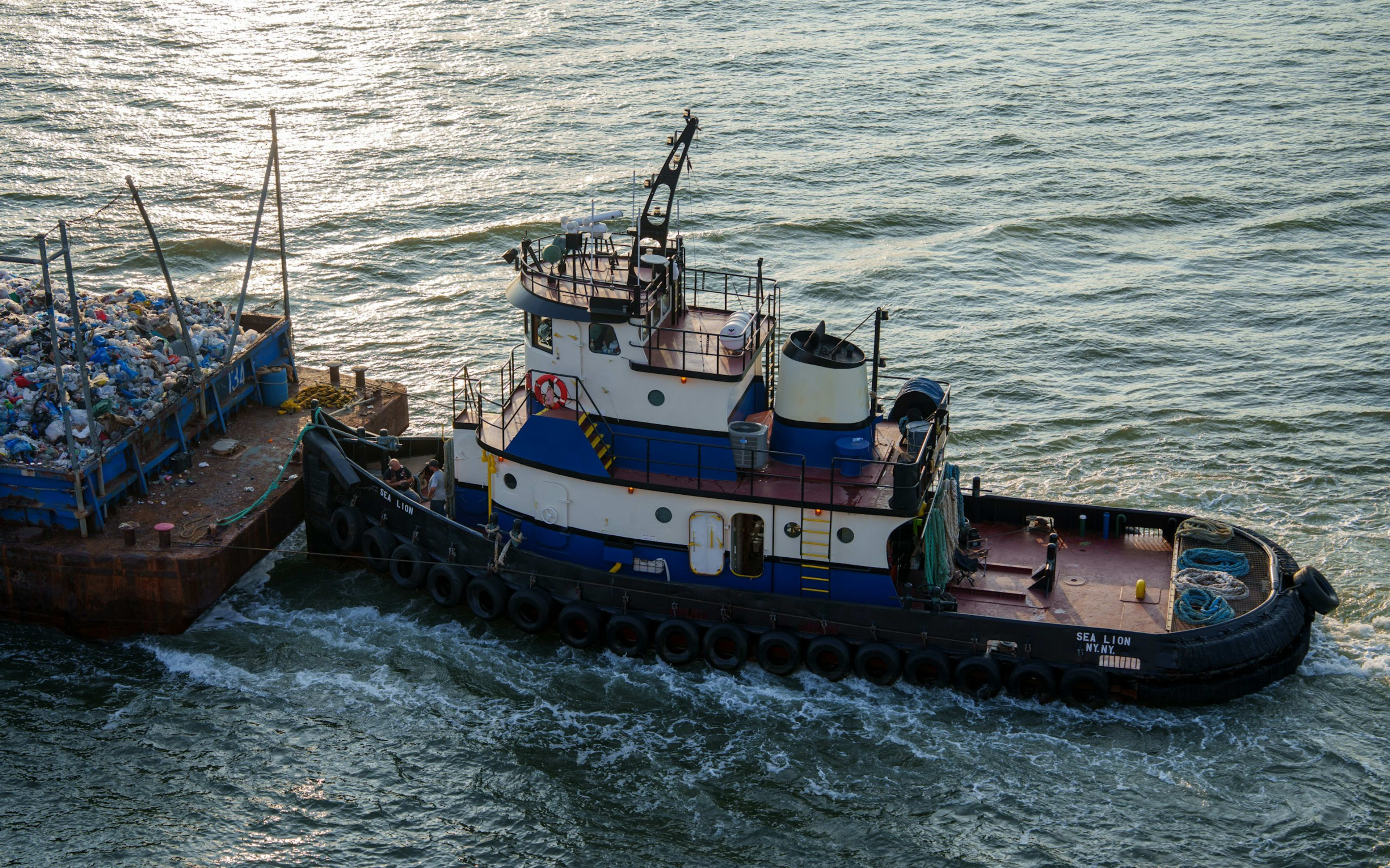 Sample photo of a tug alongside a loaded barge