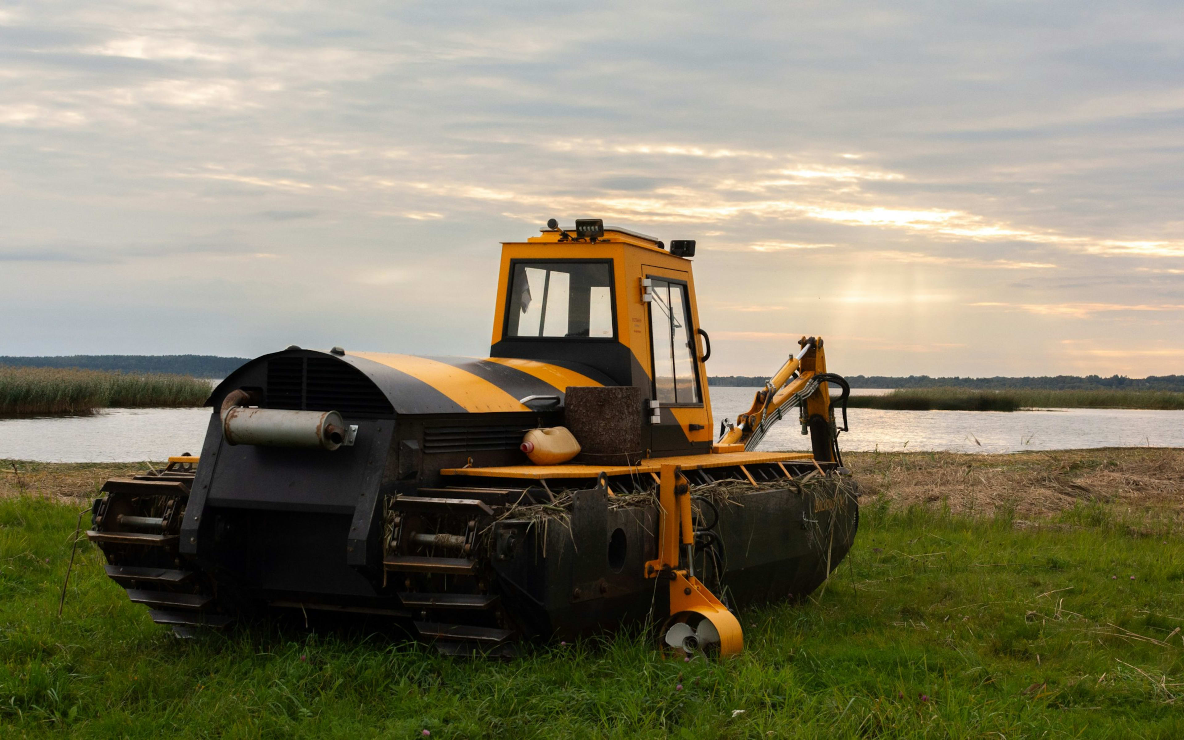 Sample photo of a tracked amphibious machine on a lakeshore